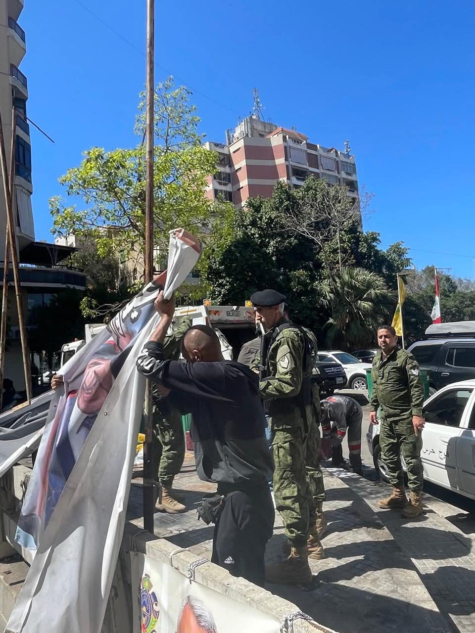 بالصور: إزالة الشعارات والصور عن الأملاك العامة في بيروت