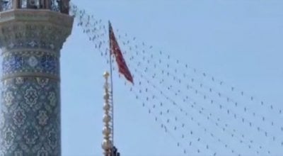 على قبة مسجد في قم... بالفيديو: إيران ترفع راية 