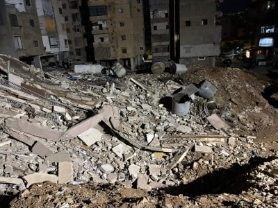 بعد انتهاء عمليات الاطفاء... انهيار المبنى في حارة حريك (صور)