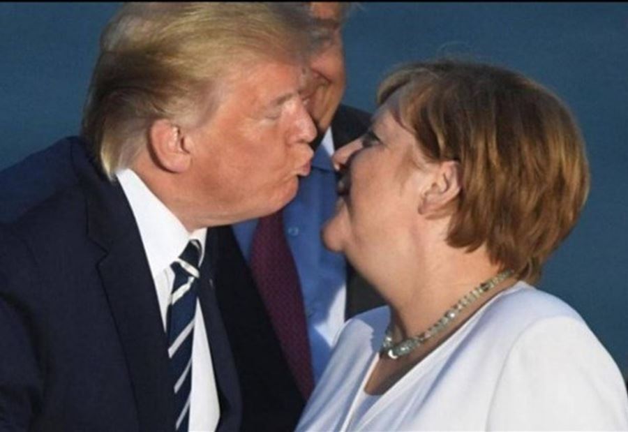 بالصورة: قبلة غريبة من ترمب لميركل تخطف الأنظار 