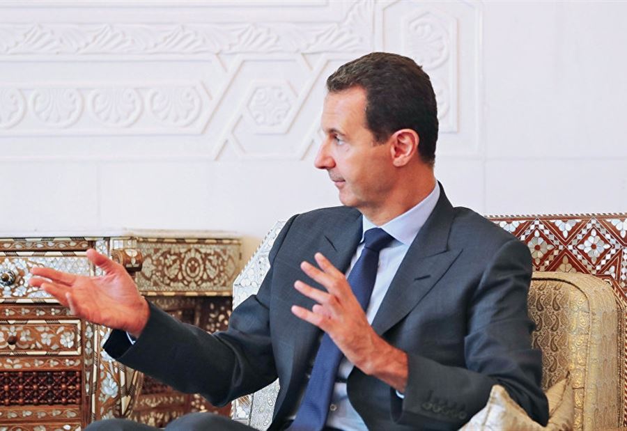 بالصورة: "سر" الوردة الصفراء أمام الأسد وضيوفه الروس 