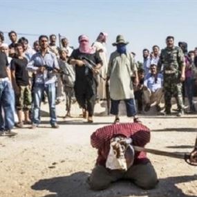 داعش يفصل رأس طفل عن جسده بالموصل