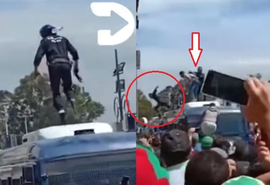 بالصورة:  متظاهرون يقذفون شرطيا جزائريا من أعلى سيارة