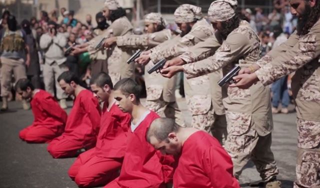 بالصور.. "داعش" يعدم عراقيين رسموا حرف "م" على الجدران