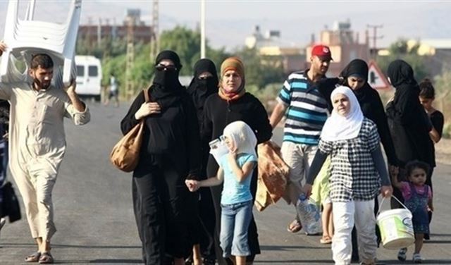 الخارجية السورية تدعو اللاجئين للعودة